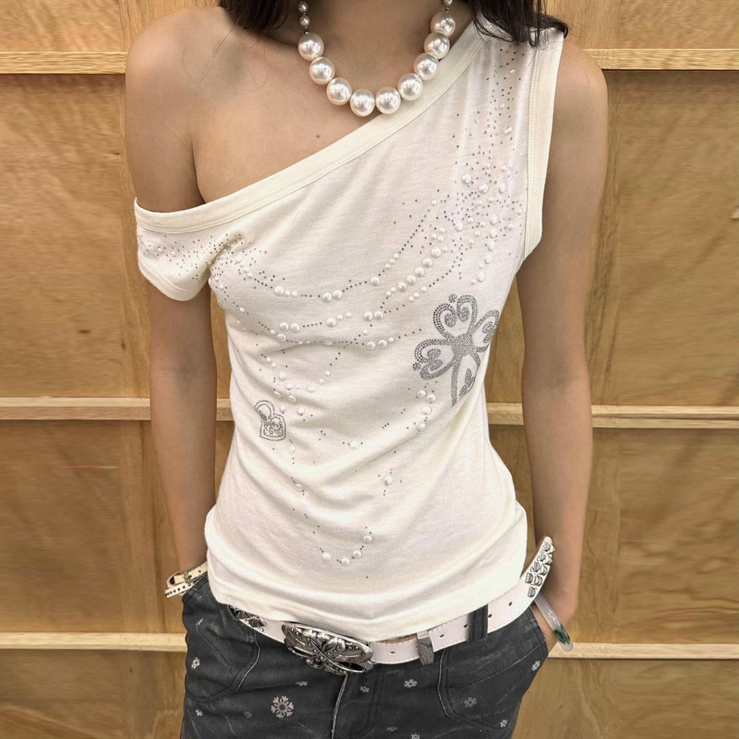 Damskin överdel med off-shoulder design och glittrande detaljer Mirla-Eva Jonsson