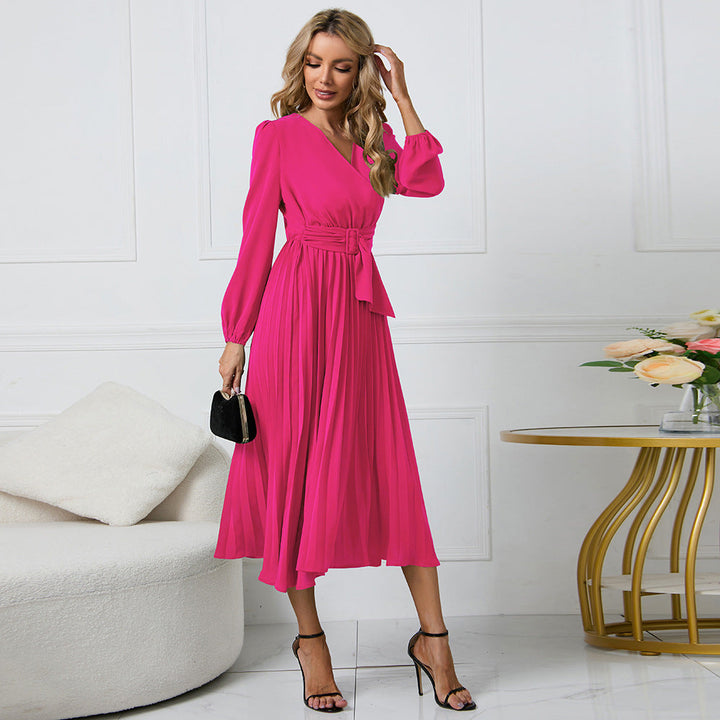 Damskjol med plisserad design och elegant midjebälte Mirla-Eva Jonsson