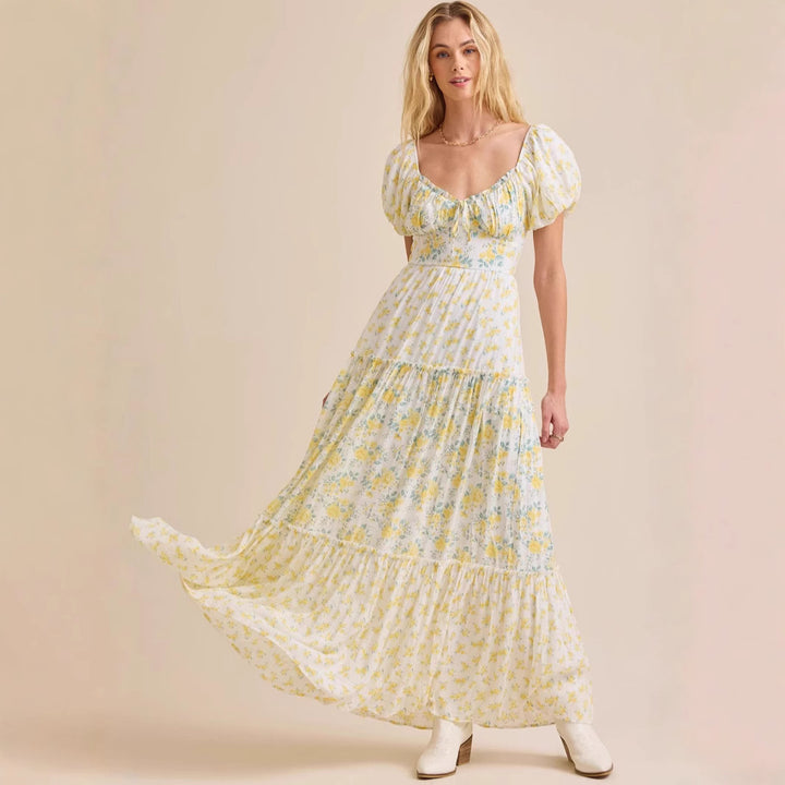 Damsklänning med blommigt mönster och högkvalitativa puffärmar Mirla-Eva Jonsson