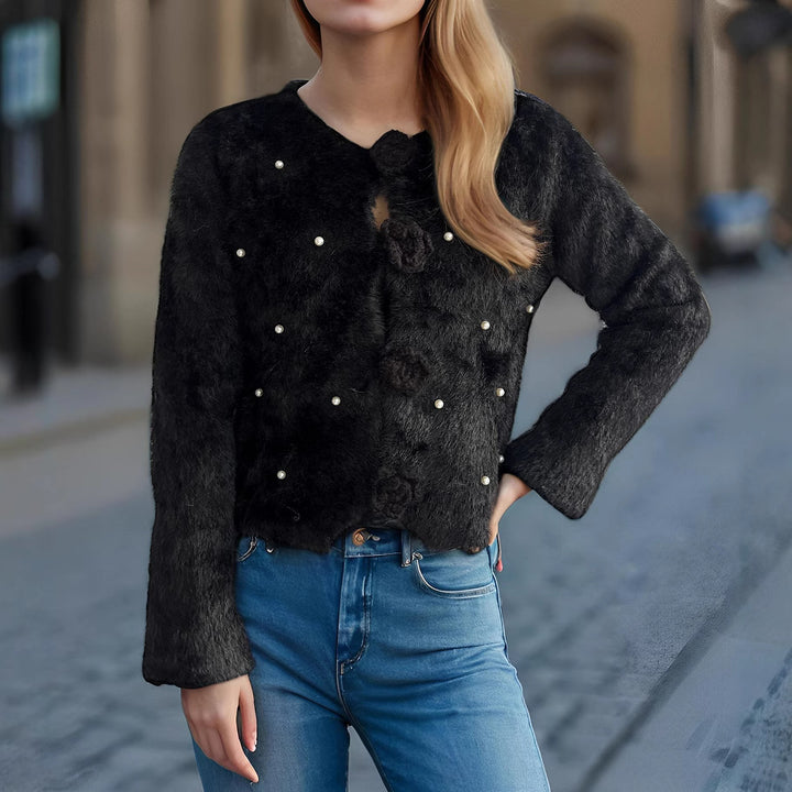 Damsko stickad jacka med florala applikationer och pärlprydd detalj Mirla-Eva Jonsson