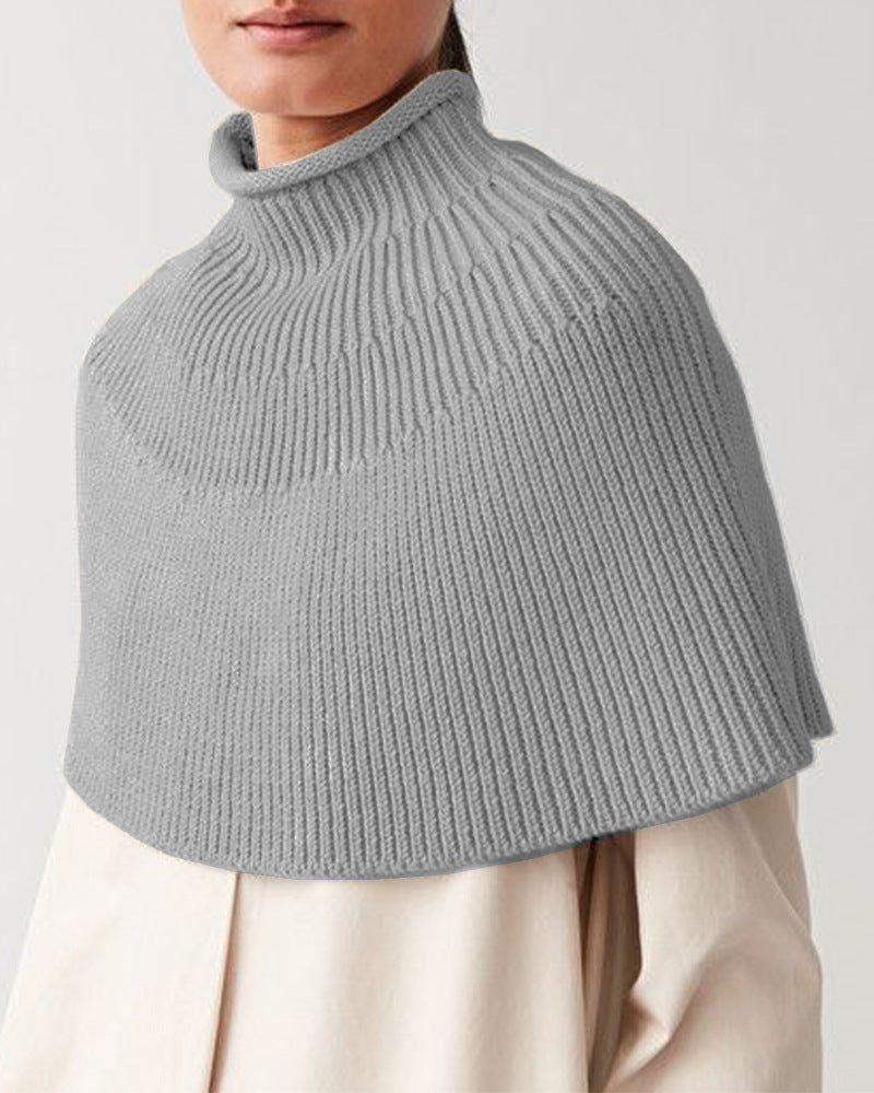 Damstickad cape med hög krage och fin ribbstruktur Eva Jonsson-Eva Jonsson