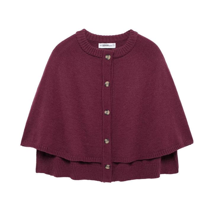 Damstickad poncho med knapppdetaljer Mirla-Eva Jonsson