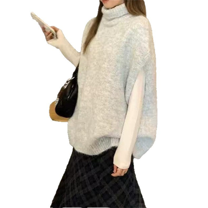 Damstickad väst med hög stängd krage och ärmlös design Mirla-Eva Jonsson