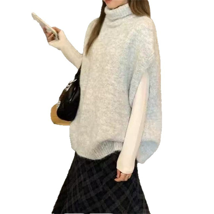 Damstickad väst med hög stängd krage och ärmlös design Mirla-Eva Jonsson