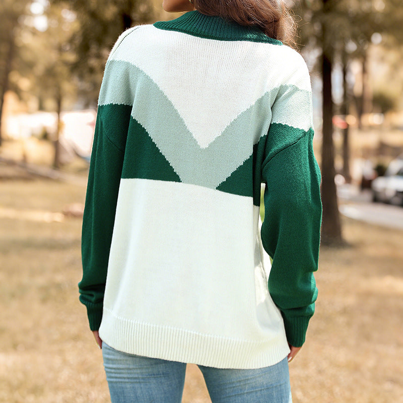 Damsweater i moderiktig färgblockdesign med knappslå och hög krage Mirla-Eva Jonsson