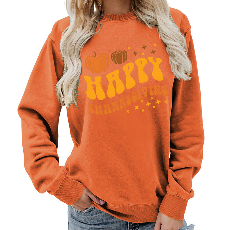 Damsweater med festligt pumpa-motiv och bekväm passform Mirla-Eva Jonsson