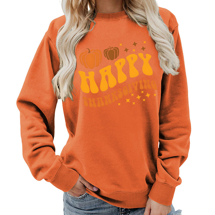 Damsweater med festligt pumpa-motiv och bekväm passform Mirla-Eva Jonsson