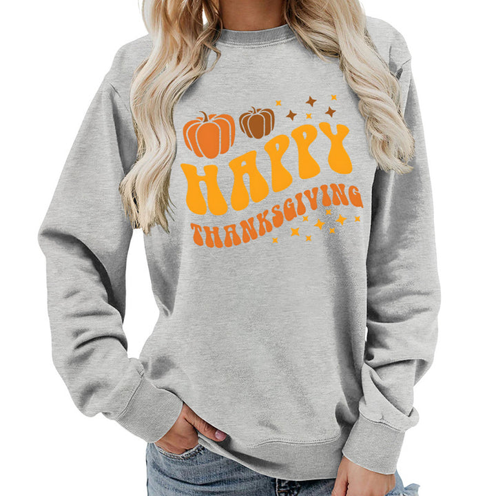 Damsweater med festligt pumpa-motiv och bekväm passform Mirla-Eva Jonsson
