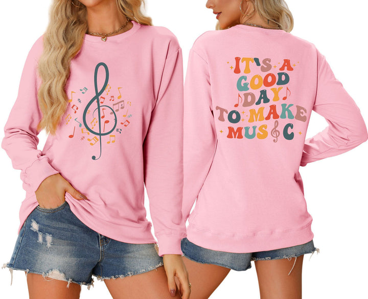 Damsweatshirt med musikaliskt motiv och kreativ text Mirla-Eva Jonsson