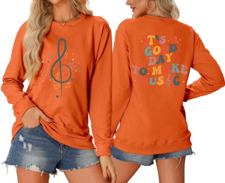 Damsweatshirt med musikaliskt motiv och kreativ text Mirla-Eva Jonsson