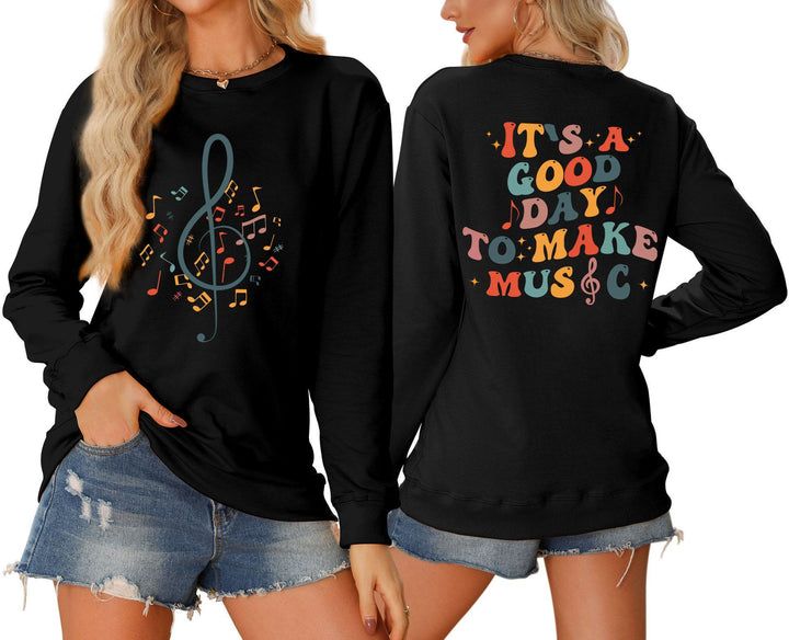 Damsweatshirt med musikaliskt motiv och kreativ text Mirla-Eva Jonsson