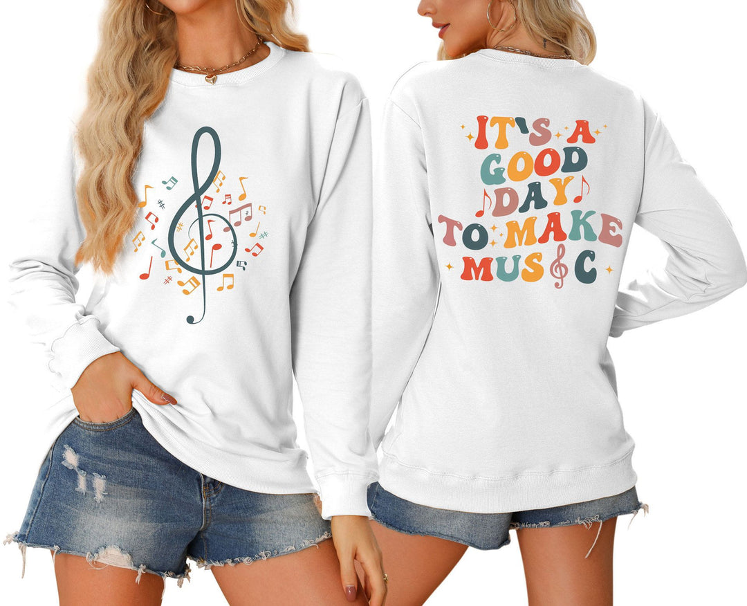 Damsweatshirt med musikaliskt motiv och kreativ text Mirla-Eva Jonsson