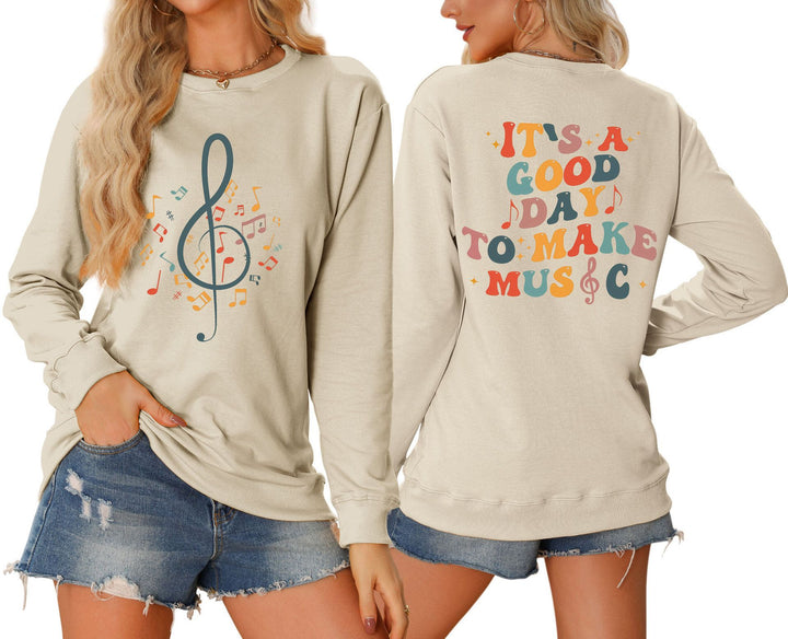 Damsweatshirt med musikaliskt motiv och kreativ text Mirla-Eva Jonsson