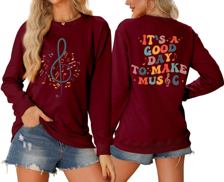Damsweatshirt med musikaliskt motiv och kreativ text Mirla-Eva Jonsson
