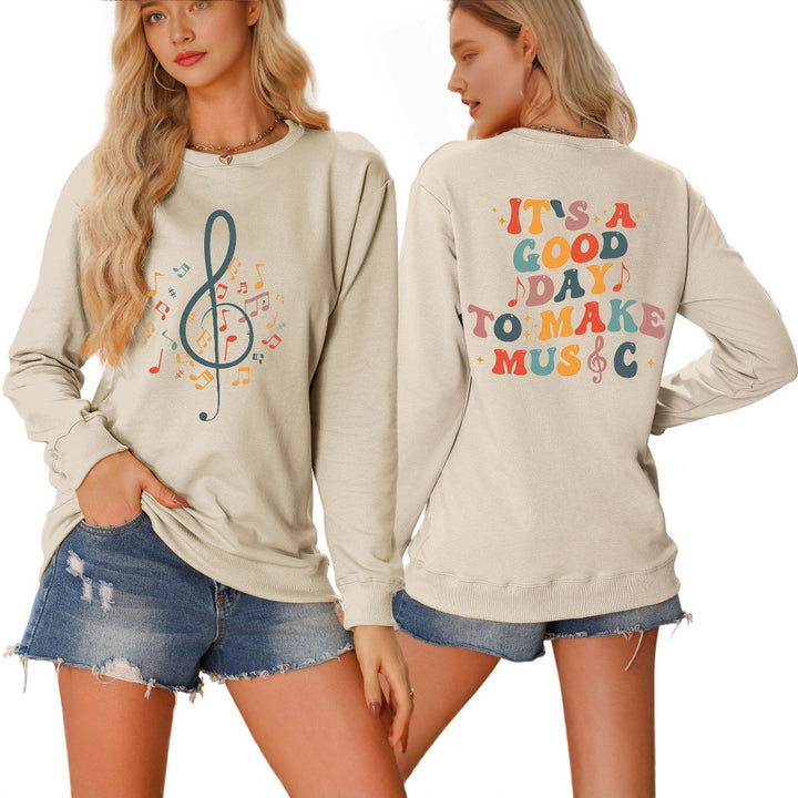 Damsweatshirt med musikaliskt motiv och kreativ text Mirla-Eva Jonsson