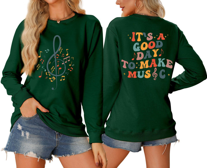 Damsweatshirt med musikaliskt motiv och kreativ text Mirla-Eva Jonsson