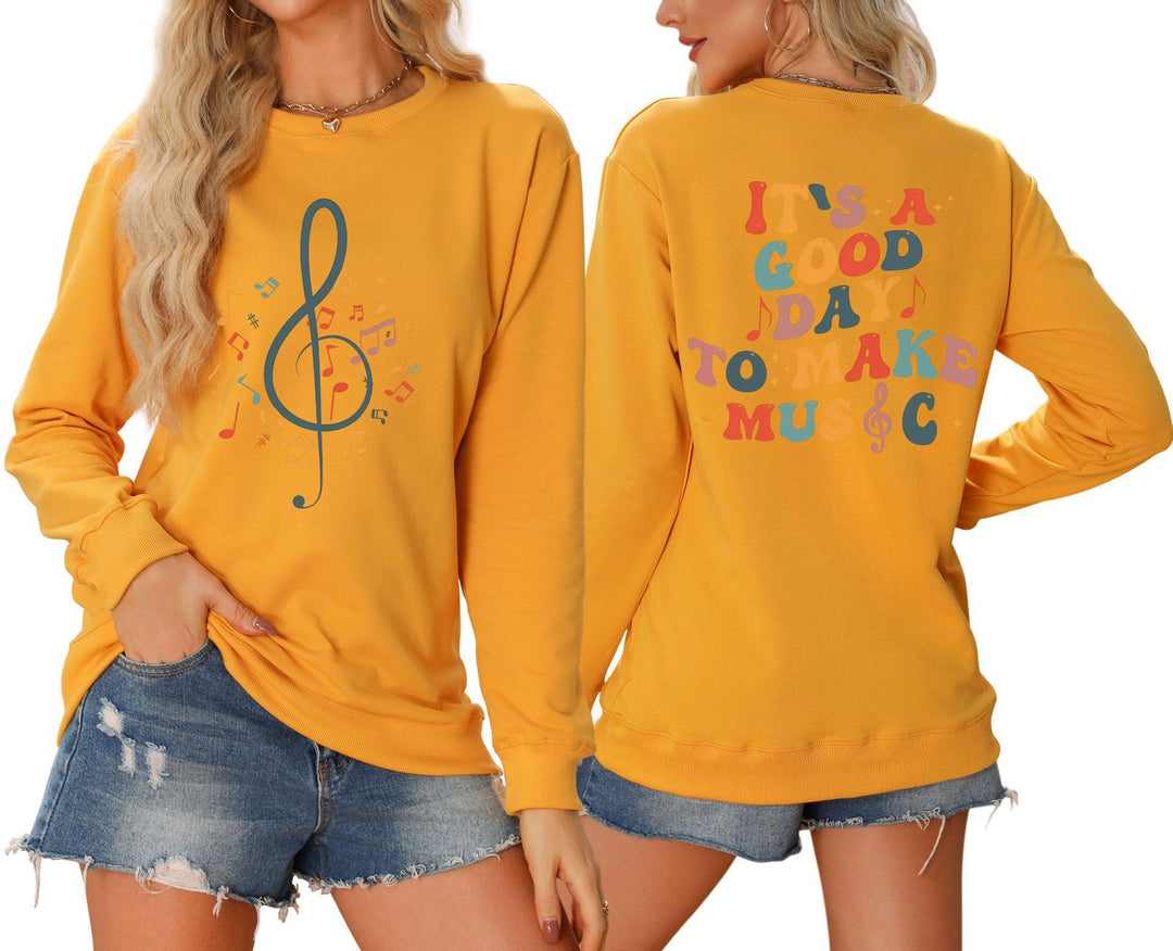 Damsweatshirt med musikaliskt motiv och kreativ text Mirla-Eva Jonsson