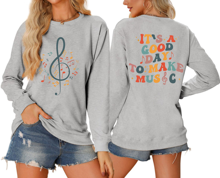 Damsweatshirt med musikaliskt motiv och kreativ text Mirla-Eva Jonsson