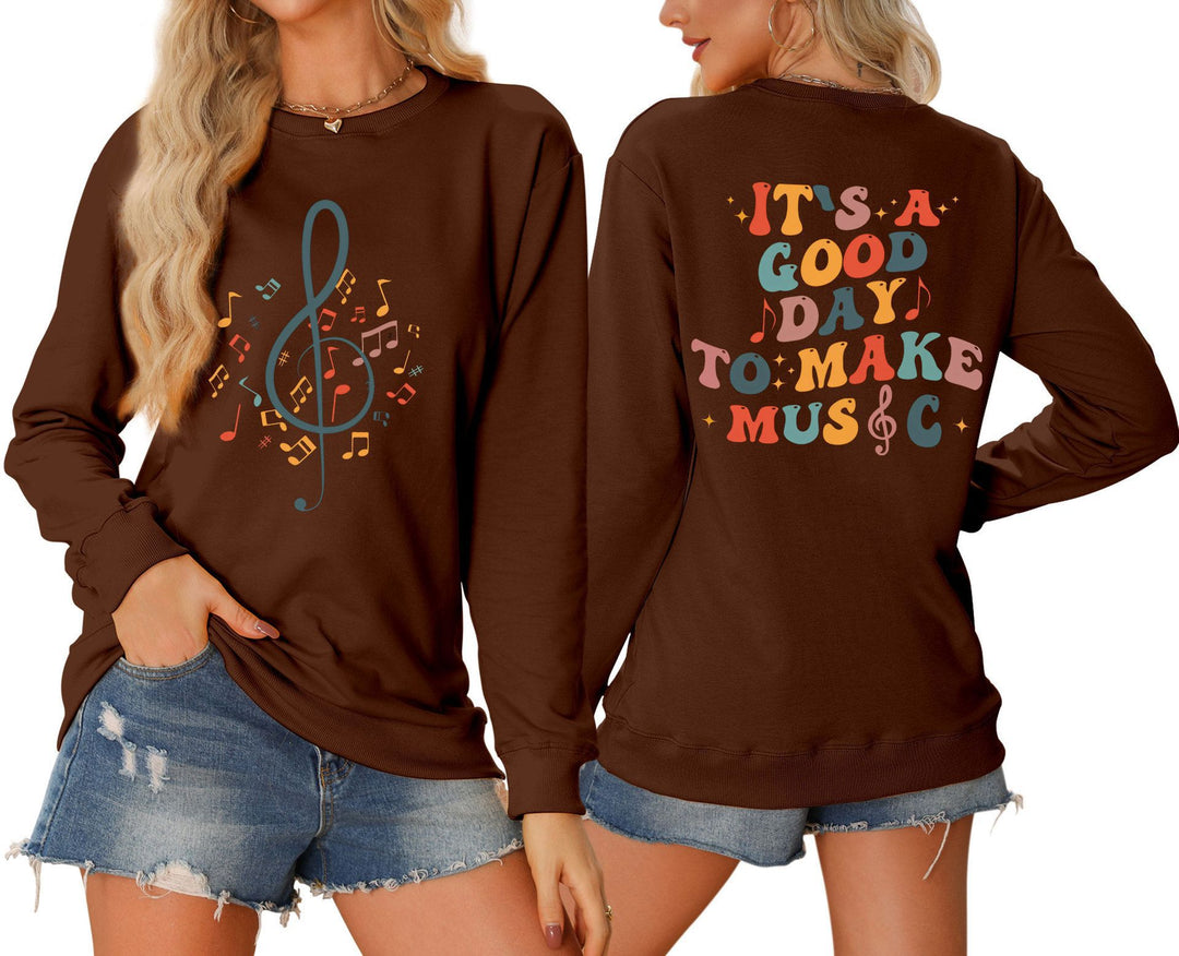 Damsweatshirt med musikaliskt motiv och kreativ text Mirla-Eva Jonsson