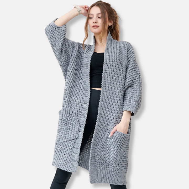 Mirla | Kappa av stickad oversized passform öppen front mönstrade fickor ribbade kanter-Eva Jonsson