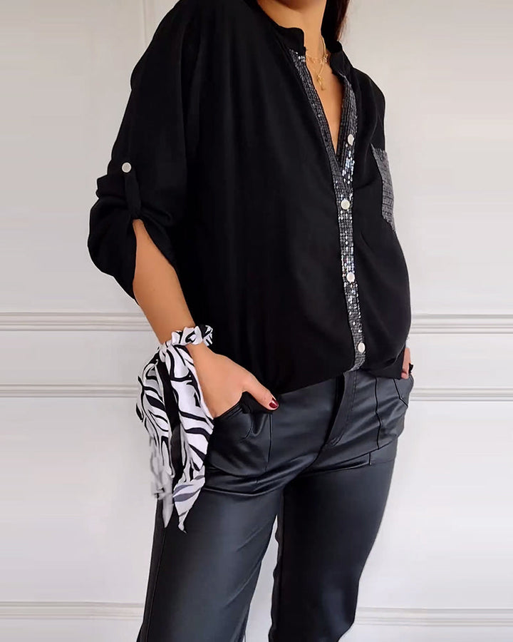 Mirla | Snygg blus med knapplist och paljettdetaljer för damer Elegant långärmad blus med paljettficka-Eva Jonsson