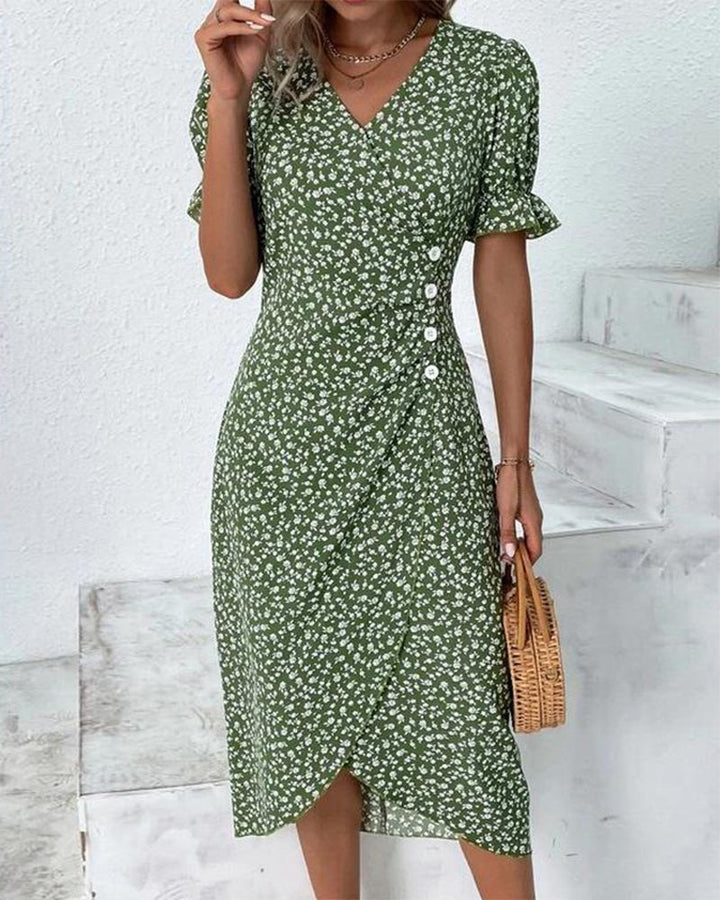 Mirla | Snyggt omslag midiklänning med blommönster och knapppdetail Elegant klänning med V-ringning och blommtryck-Eva Jonsson