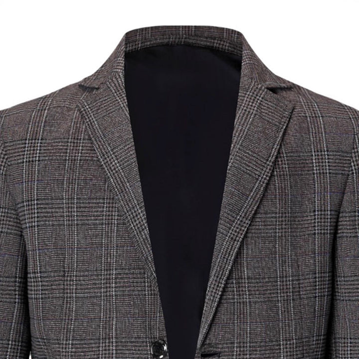 Herr elegant blazer med modernt rutmönster och praktiska fickor Mirla-Eva Jonsson