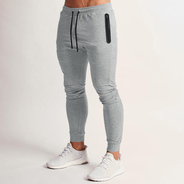 Herr sportig fitnessbyxor med ventilerande insatser och praktiska dragkedjefickor Eva Jonsson-Eva Jonsson