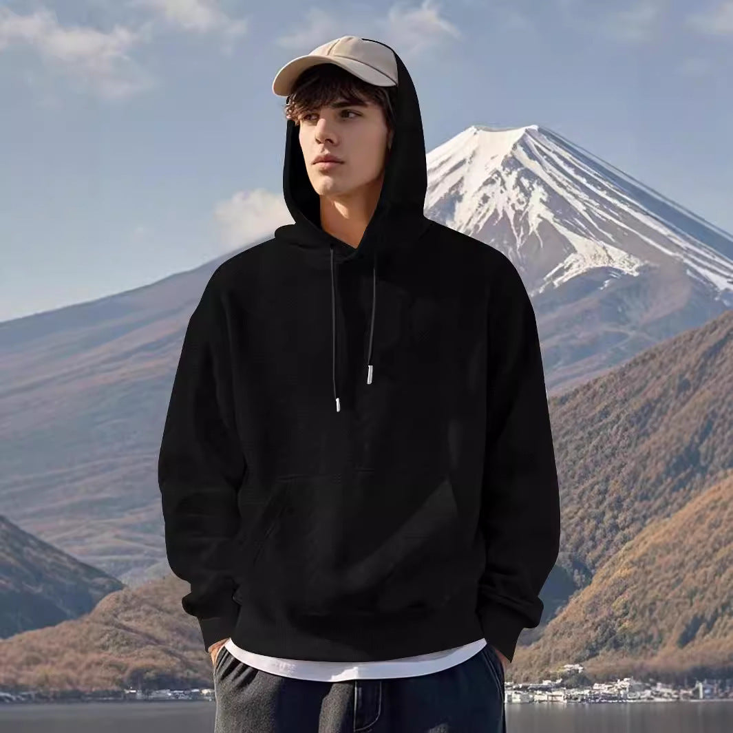 Herrar Hoodie med strukturerad design och kängurufickor Mirla-Eva Jonsson