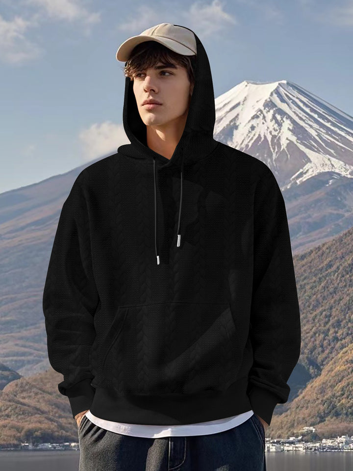 Herrar Hoodie med strukturerad design och kängurufickor Mirla-Eva Jonsson