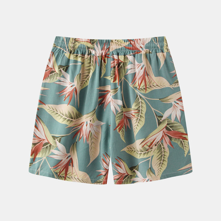 Herrar badshorts med tropiskt blad- och blommönster Mirla-Eva Jonsson