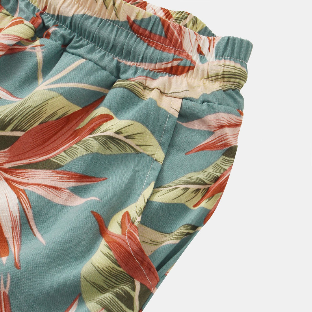 Herrar badshorts med tropiskt blad- och blommönster Mirla-Eva Jonsson