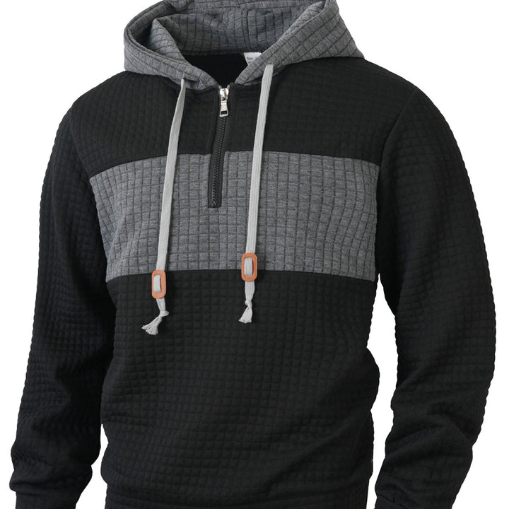 Herrar hoodie med 1/4-dragkedja och strukturerad design Mirla-Eva Jonsson