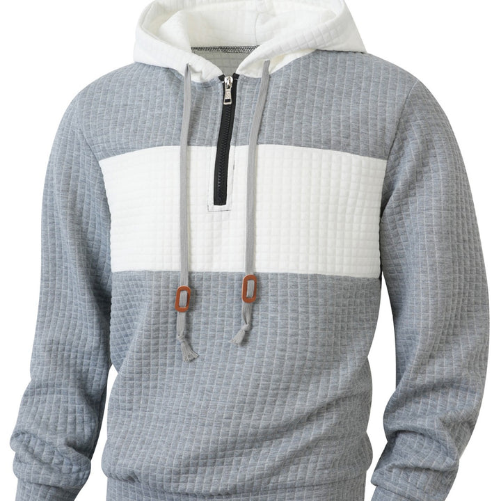 Herrar hoodie med 1/4-dragkedja och strukturerad design Mirla-Eva Jonsson