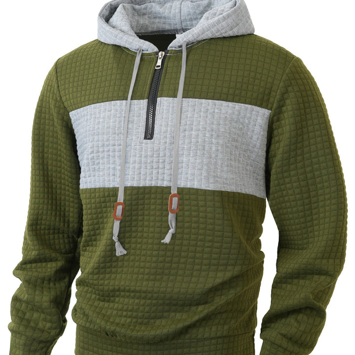 Herrar hoodie med 1/4-dragkedja och strukturerad design Mirla-Eva Jonsson