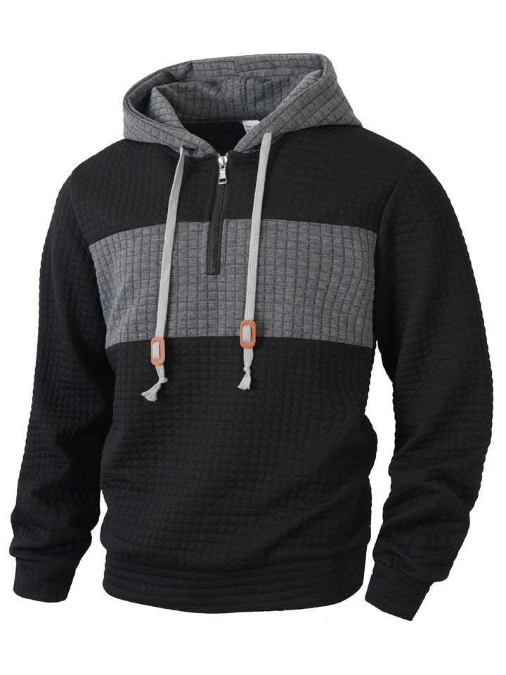 Herrar hoodie med 1/4-dragkedja och strukturerad design Mirla-Eva Jonsson