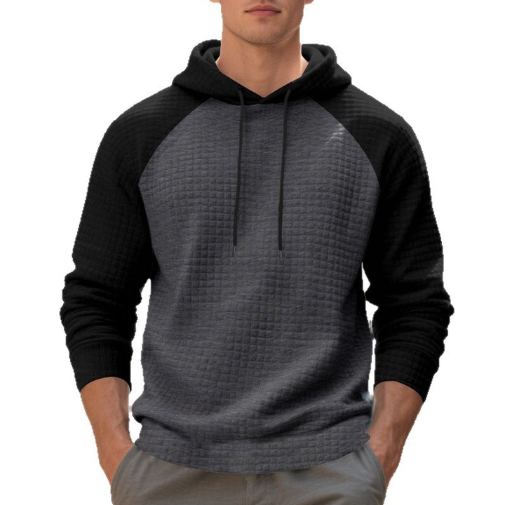 Herrar hoodie med strukturerad tyg och kontrasterande ärmar Mirla-Eva Jonsson