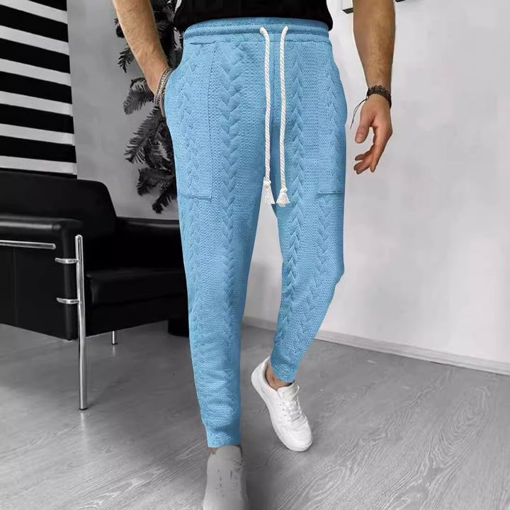 Herrar modiska joggingbyxor med unik strukturdesign Mirla-Eva Jonsson