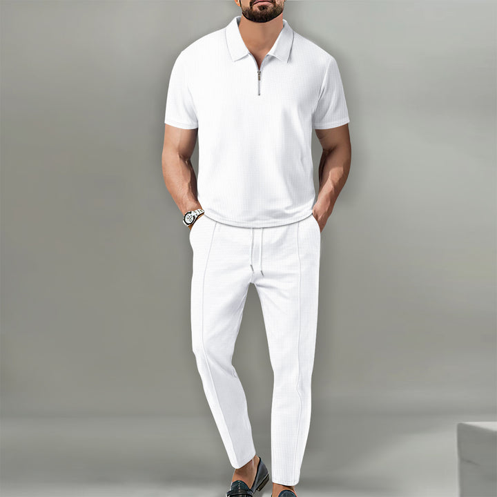 Herrar polo t-shirt med dragkedja och eleganta sportbyxor Mirla-Eva Jonsson