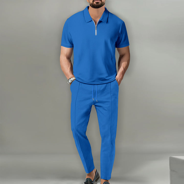 Herrar polo t-shirt med dragkedja och eleganta sportbyxor Mirla-Eva Jonsson