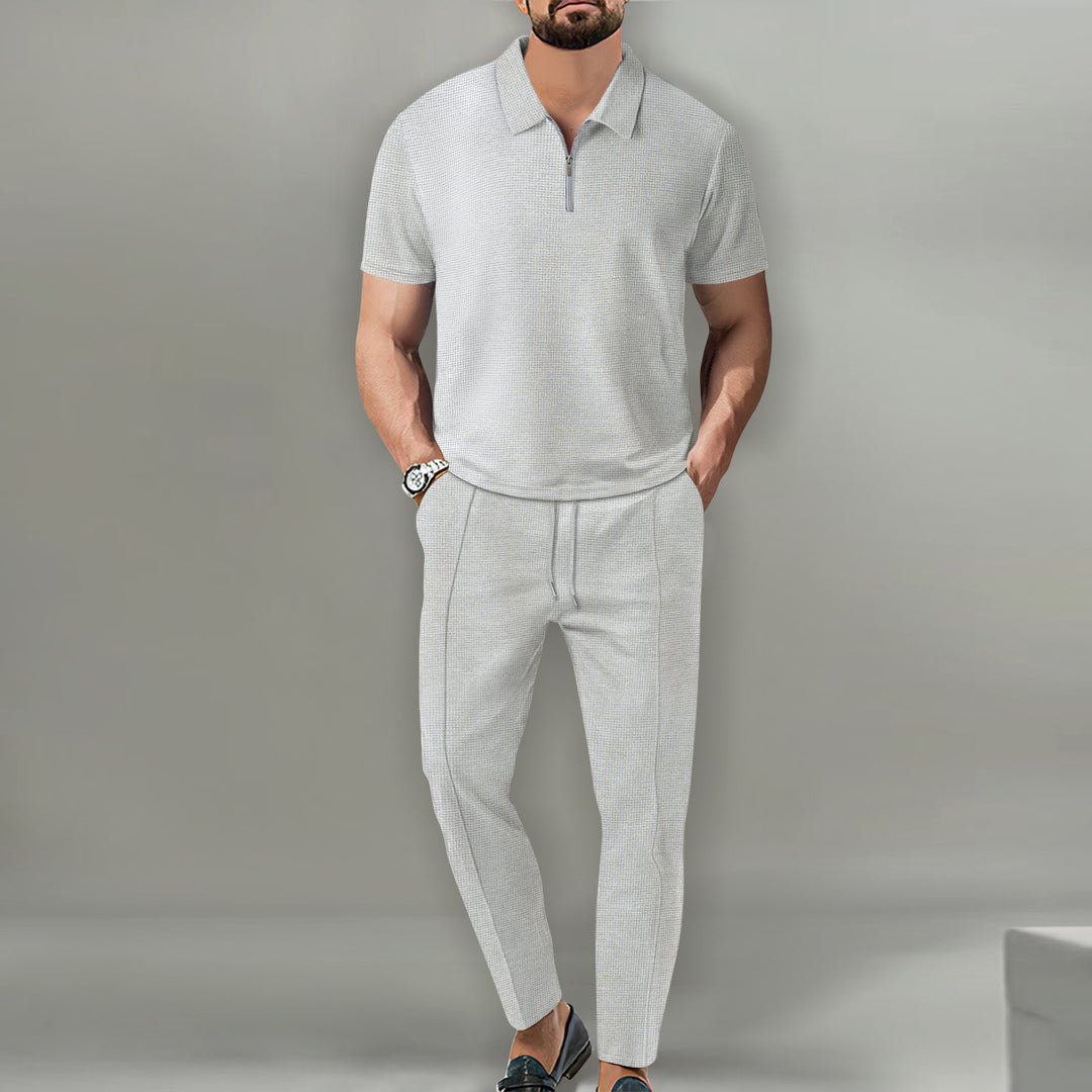 Herrar polo t-shirt med dragkedja och eleganta sportbyxor Mirla-Eva Jonsson