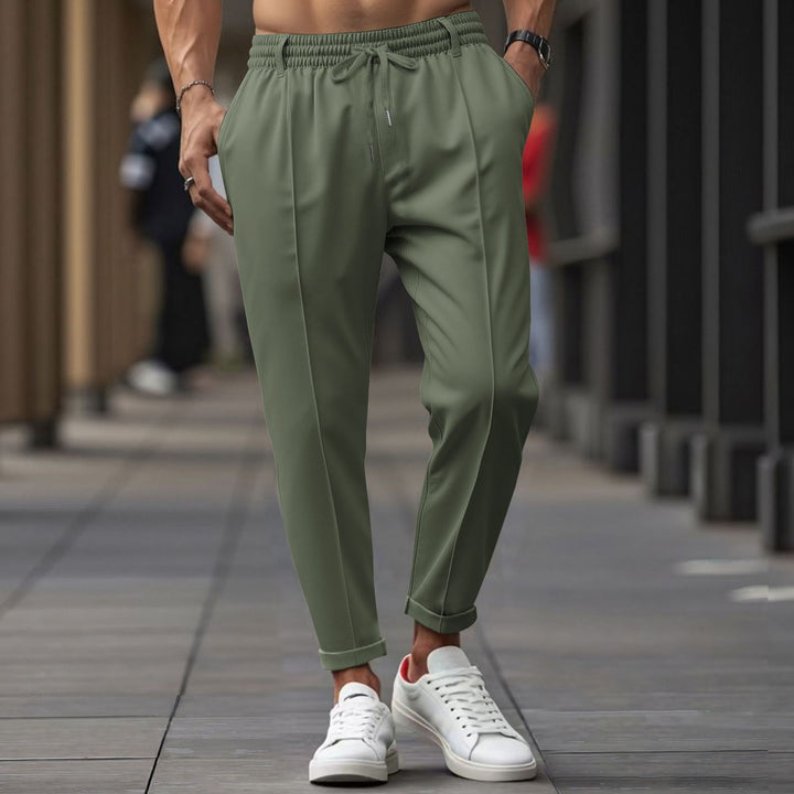 Herrarnas avslappnade joggingbyxor med elastisk midja och praktiska sidofickor Mirla-Eva Jonsson