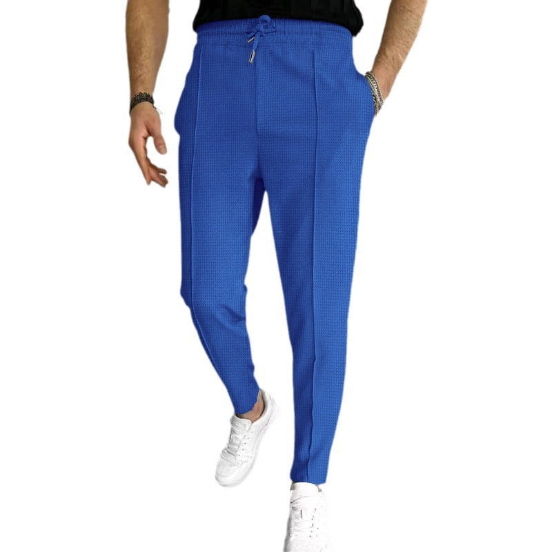 Herrarnas eleganta fritidsbyxor med elastisk midja och sidofickor Mirla-Eva Jonsson