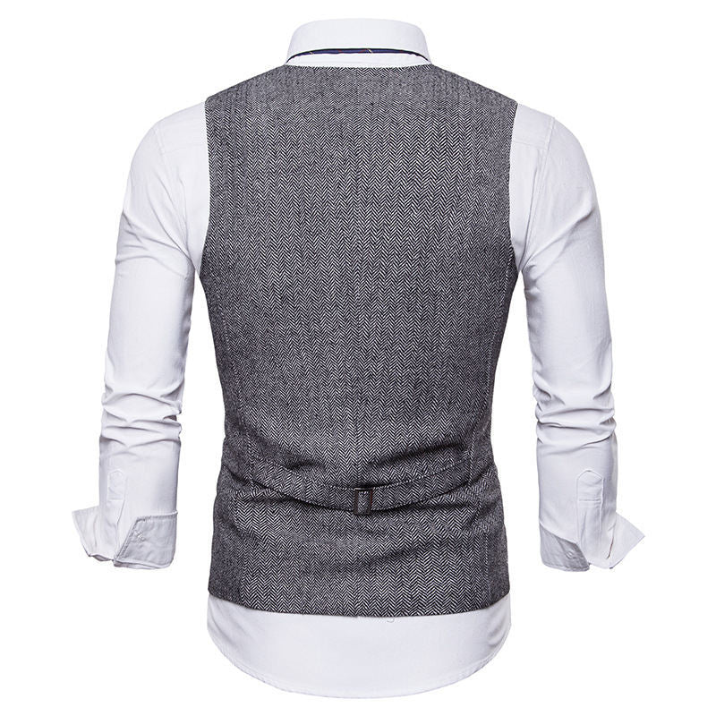 Herrarnas eleganta väst i klassisk herringbone-design med praktiska fickor Mirla-Eva Jonsson