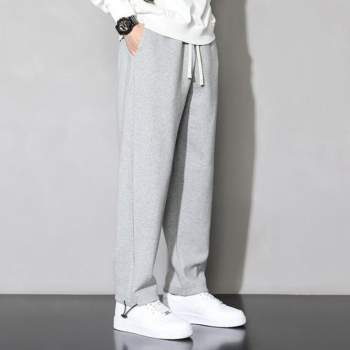Herrarnas fritids-joggingbyxor med elastisk midja och sidofickor med dragkedja Mirla-Eva Jonsson