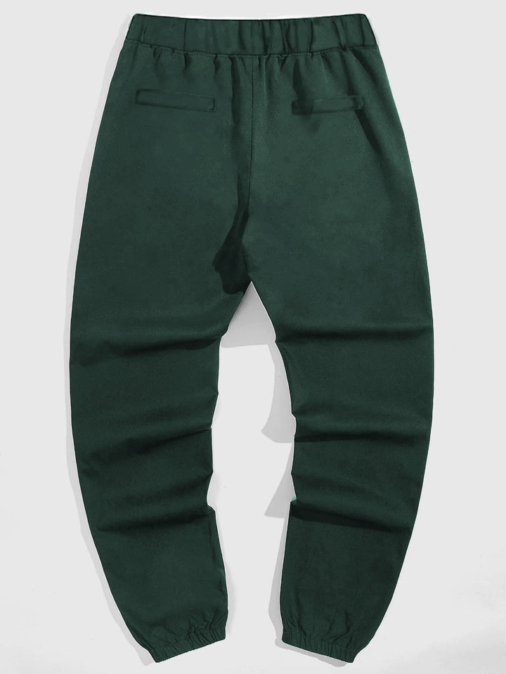 Herrarnas fritids joggingbyxor med kontrasterande dragkedjefickor och elastisk midja Mirla-Eva Jonsson