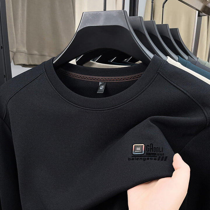 Herren långärmad sweatshirt med strukturerad väv och stiligt logotyp Mirla-Eva Jonsson
