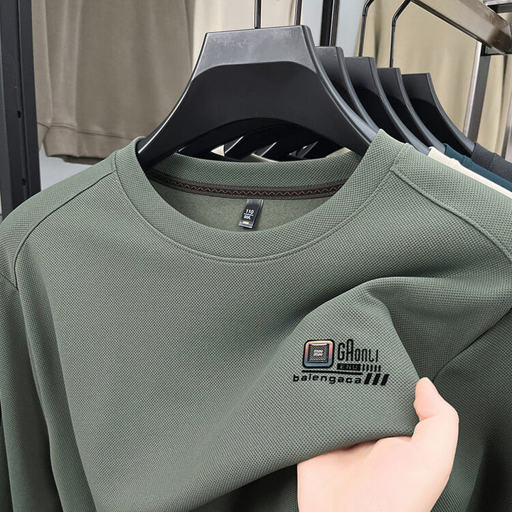 Herren långärmad sweatshirt med strukturerad väv och stiligt logotyp Mirla-Eva Jonsson