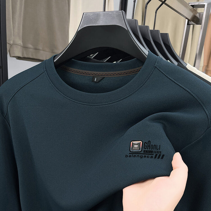 Herren långärmad sweatshirt med strukturerad väv och stiligt logotyp Mirla-Eva Jonsson