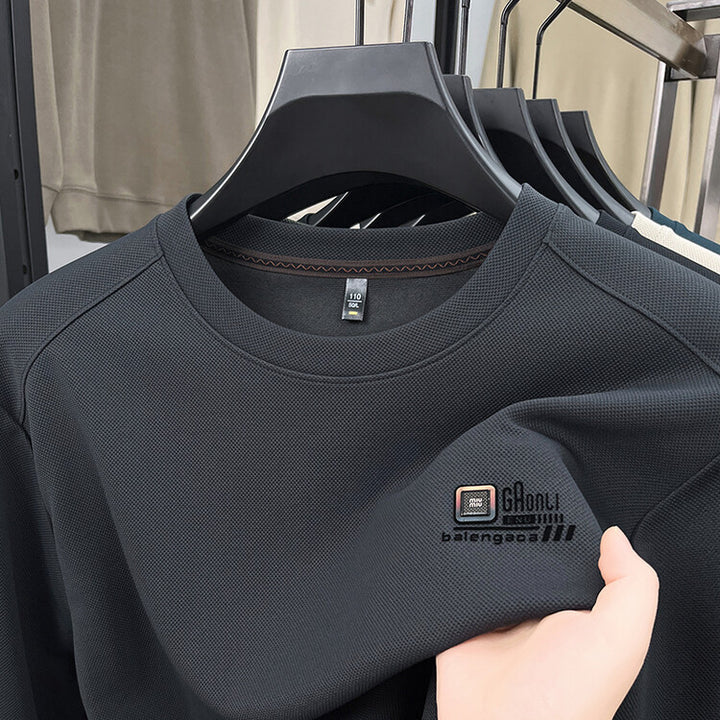 Herren långärmad sweatshirt med strukturerad väv och stiligt logotyp Mirla-Eva Jonsson